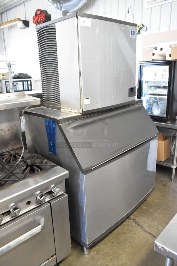 Manitowoc IY1106A-261 stainless steel commercial ice head on ice bin, 208-230V, 1 phase, in operational condition.