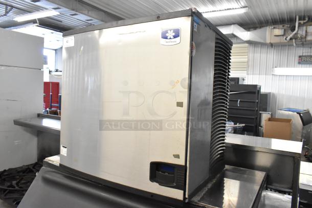 Manitowoc IY1106A-261 stainless steel commercial ice head on bin. 208-230V, 1 phase. Visible labels, standard wear.