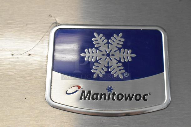 Manitowoc IY1106A-261 stainless steel ice head label, showing brand logo and snowflake design.