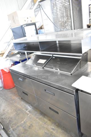 Delfield UCD4464N-12-DD5 stainless steel sandwich prep table with four drawers, overhead shelf. 115 volts, 1 phase.
