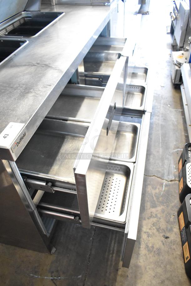 Delfield UCD4464N-12-DD5 stainless steel prep table, four drawers, overshelf, 115V, 1 Phase, used condition, visible label.