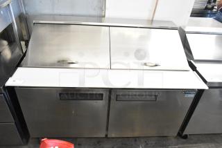 Dukers DSP60 stainless steel commercial prep table with bain marie top, on casters. Model DSP60, 115V, 1 phase.