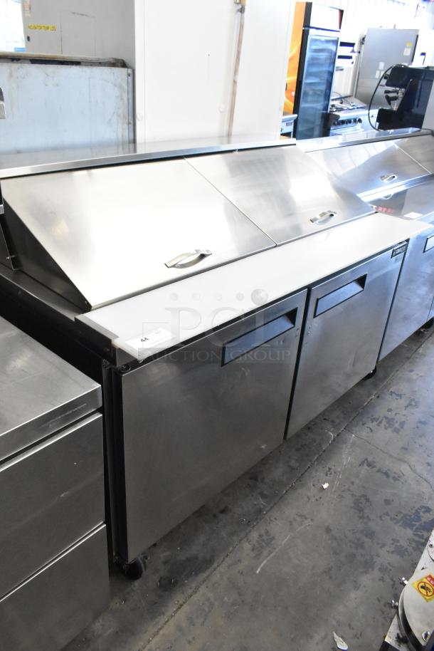 Dukers DSP60 stainless steel commercial sandwich salad prep table with bain marie mega top. Mounted on commercial casters.