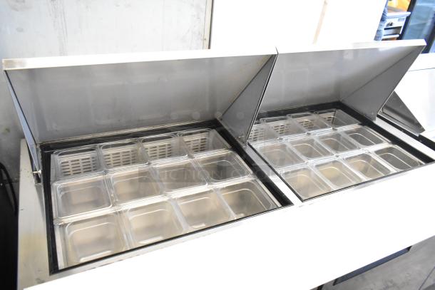 Dukers DSP60 stainless steel commercial sandwich salad prep table with bain marie mega top, shown open with containers.