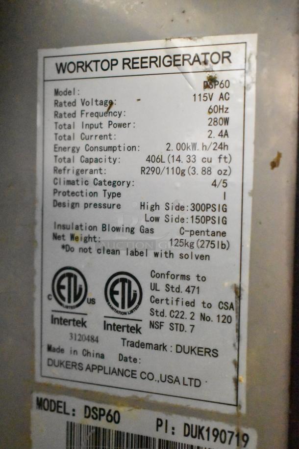 Dukers DSP60 Stainless Steel Prep Table label detailing voltage, power, energy use, certifications, and model info.