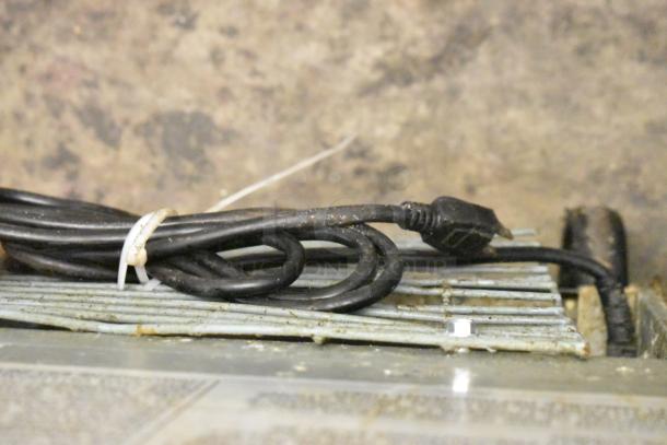 Dukers DSP60 commercial prep table; visible power cord, worn surfaces need cleaning; 115V, 1 Phase.
