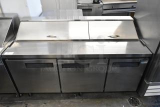 Dukers DSP72 stainless steel prep table with bain marie top, commercial casters, 115V, 1 phase. Excellent condition.