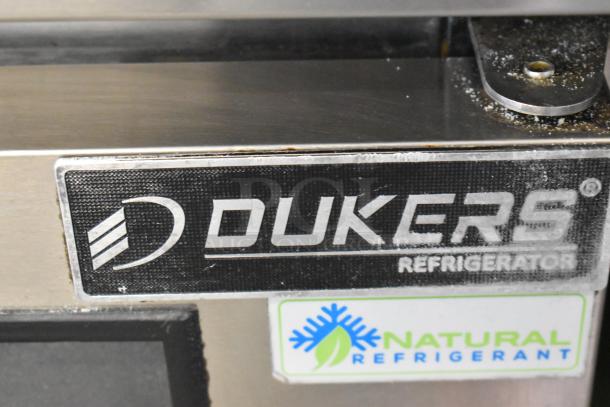 Dukers DSP72 stainless steel commercial sandwich salad prep table with label showing natural refrigerant use.