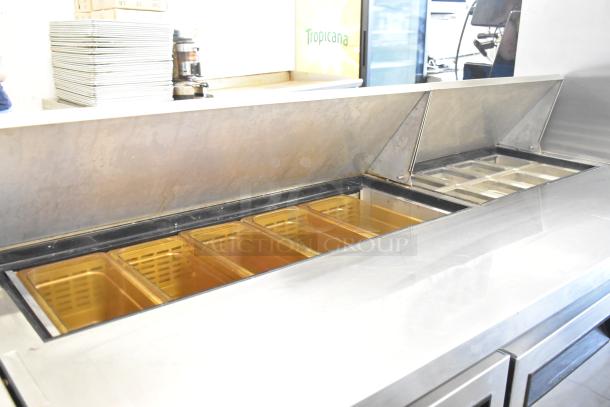 Dukers DSP72 stainless steel sandwich salad prep table with bain marie top and casters, 115V, excellent condition.