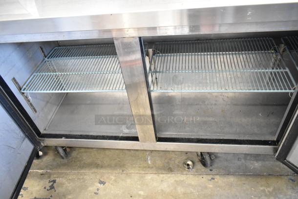 Dukers DSP72 stainless steel sandwich prep table with open doors, wire shelving, on commercial casters. 115V, 1 phase.