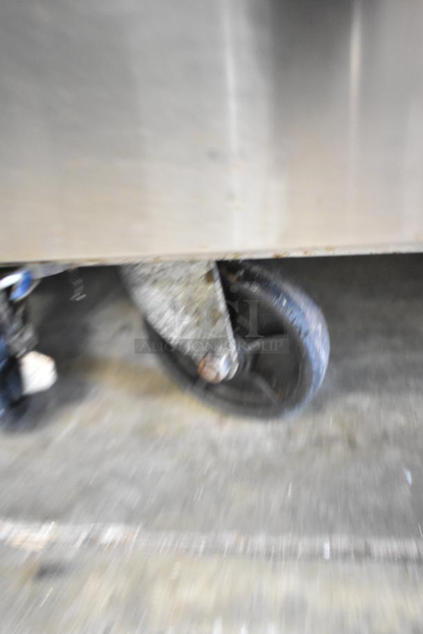Dukers DSP72 prep table wheel; stainless steel, commercial casters, used condition, part of sandwich and salad table.