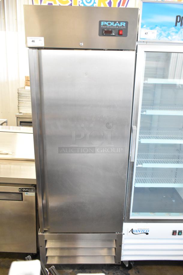 Polar GE004 stainless steel commercial single door reach-in cooler with poly coated racks and casters. 115V, 1 phase.