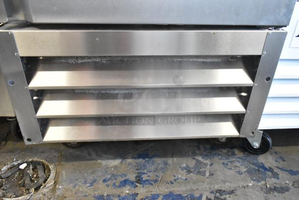 Polar GE004 stainless steel cooler base, showing commercial casters and vents. Suitable for food service, 115V.