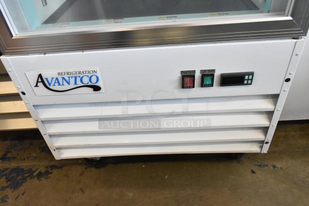 2022 Avantco 178GDC12FHCW commercial cooler, single door, poly coated racks, 115V, 1 phase. Power and light switches visible.