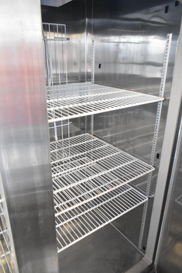 Summit ARS49ML stainless steel commercial cooler, 2 doors, poly coated racks, on commercial casters, 115V, 1-phase.