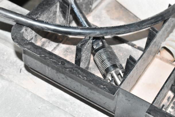 Summit ARS49ML commercial cooler detail showing cable and plug. Stainless steel finish, poly-coated racks, 115V, 1 phase.