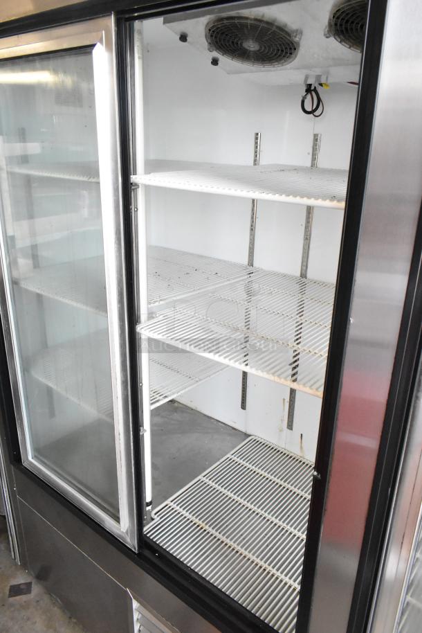 Leader LS96S S/C metal commercial 4-door reach-in cooler with poly coated racks, shows interior shelving. 115 volts, 1 phase.
