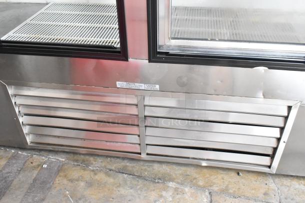 Leader LS96S S/C 4-door reach-in cooler, metal finish, poly-coated racks, visible caution label, 115V, 1 Phase.