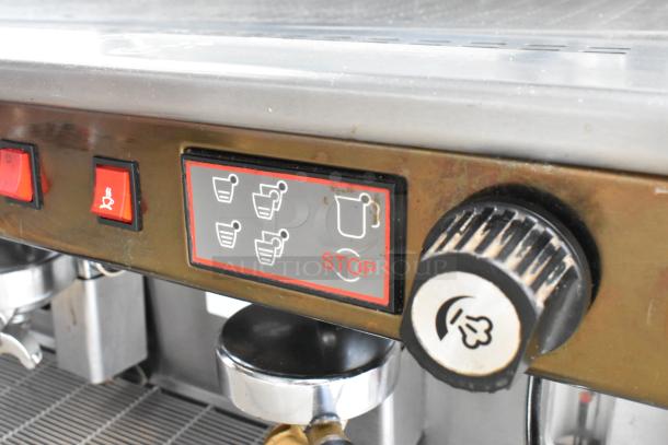 Wega Formula EVO 3 espresso machine control panel with cup icons, stop button, and steam control knob.