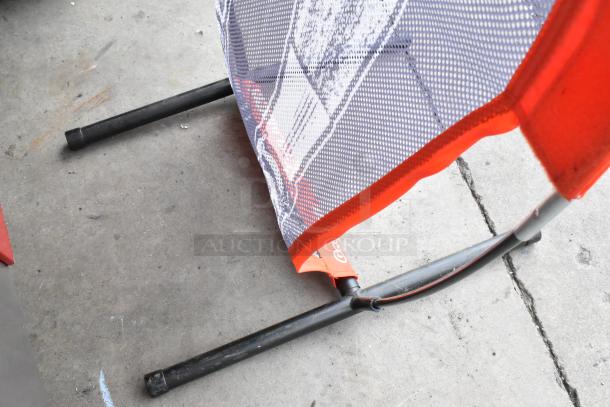 GoSports Xtraman Net in good condition, featuring a sturdy black metal frame and durable mesh with red accents.