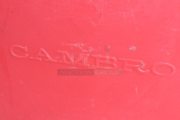Red Cambro 300MPG insulated catering case, poly construction. Visible brand marking. Scratches indicate moderate use.