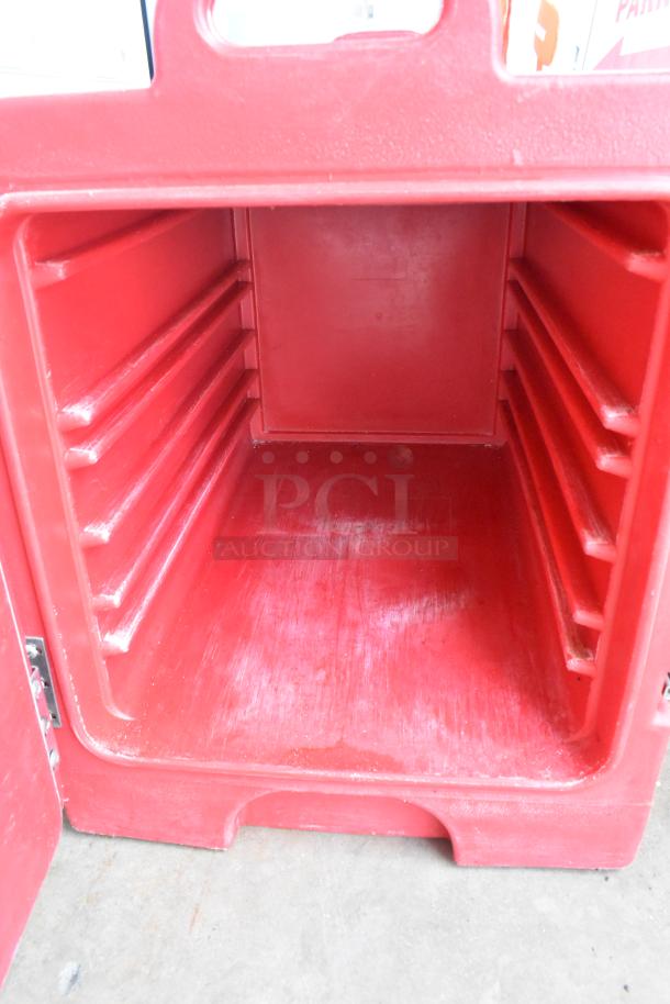 Cambro 300MPG red poly insulated food carrying case, used condition, open view showing interior shelving slots.
