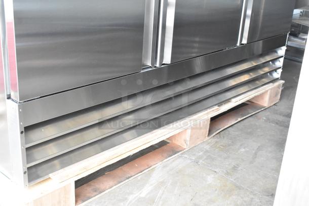 Brand new Avantco 178SS3RHC stainless steel 3-door reach-in cooler on pallet. Some scratches and dents visible.