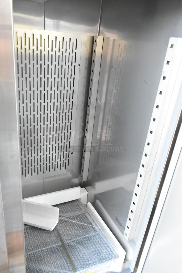 Brand new Avantco 178SS3RHC stainless steel commercial 3-door cooler interior with poly-coated racks, 115 Volts, minor dents.