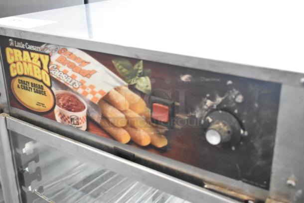 00925E-073 Metal Commercial Countertop Merchandiser, 120V, 1 Phase. Features Little Caesars branding and control dials.