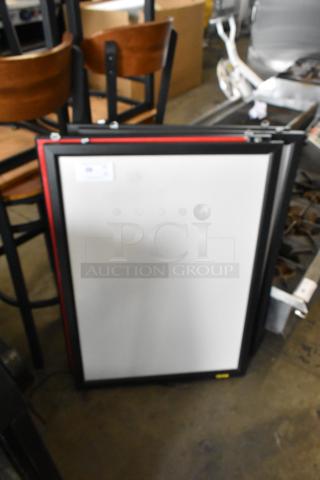 Four framed menu boards, black trim, stackable. Good condition. Ideal for restaurant displays. Auction tag visible.