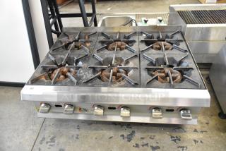 2023 CPG 351RCPG36NL 6-burner stainless steel gas range, 132,000 BTU, commercial countertop model, shows signs of use.