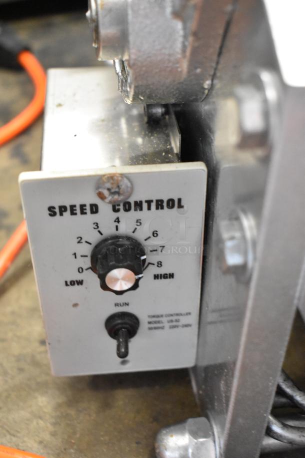 Metal countertop sheeter with visible speed control dial and toggle switch, model UB-52, in used condition.
