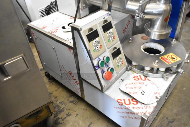 Stainless steel commercial unit with MNMRV40 gear reducer, featuring control buttons and displays, mounted on commercial casters.