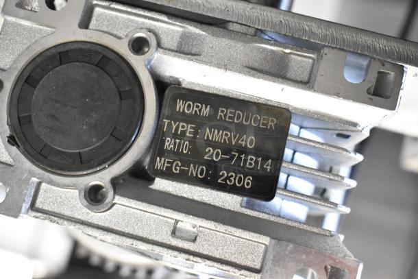 Stainless steel commercial unit with MNMRV40 gear reducer, showing worm reducer label with type, ratio, and MFG number.
