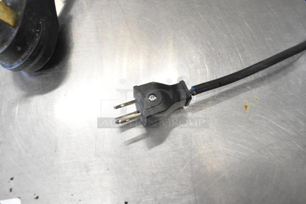 Stainless steel commercial unit plug on clean surface, featuring MNMRV40 gear reducer, in good condition.