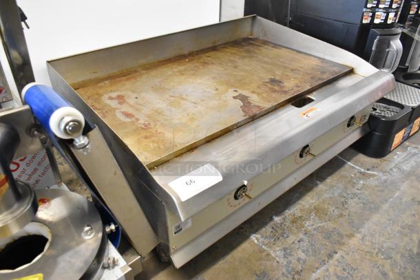 2023 CPG 351GTCPG36NL stainless steel commercial flat top griddle, natural gas, 90,000 BTU, used, minor surface wear.