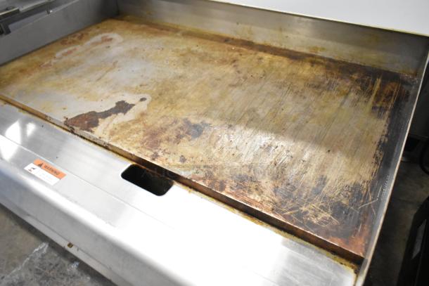 2023 Cooking Performance Group stainless steel commercial flat top griddle, model 351GTCPG36NL, natural gas, 90,000 BTU.