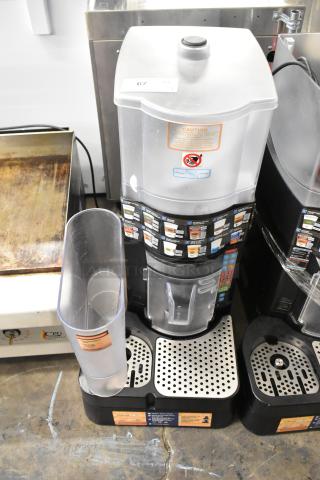 Taylor X83684-12 countertop frozen drink machine, metal, excellent condition, with visible caution labels and control panel.