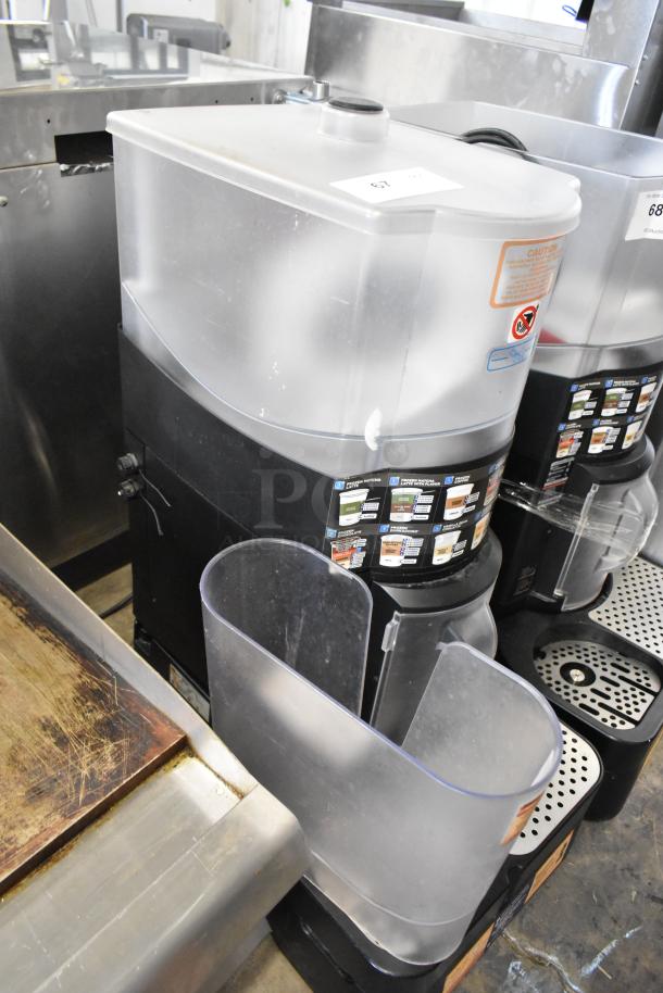 Taylor X83684-12 metal countertop frozen drink mixing machine. Features a clear mixing chamber, labeled controls, and excellent condition.