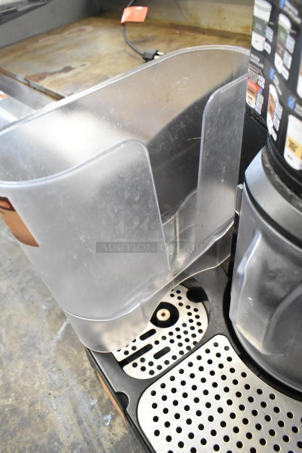 Taylor X83684-12 metal commercial frozen drink mixing machine, used, with plastic hopper and metal drip tray.