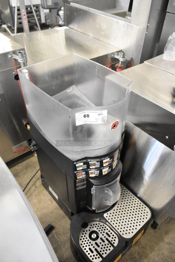 Taylor X83684-12 metal commercial countertop frozen drink mixing machine, features control panel and drip trays, in good condition.