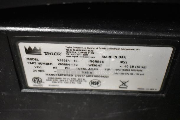 Taylor X83684-12 metal countertop frozen drink mixer, commercial use. Label shows model, part number, and NSF certification.