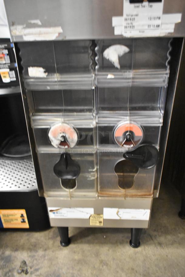 Bunn ICDD-3 stainless steel iced coffee dispenser reservoir, dual spouts, visible wear, commercial use, model labeling.