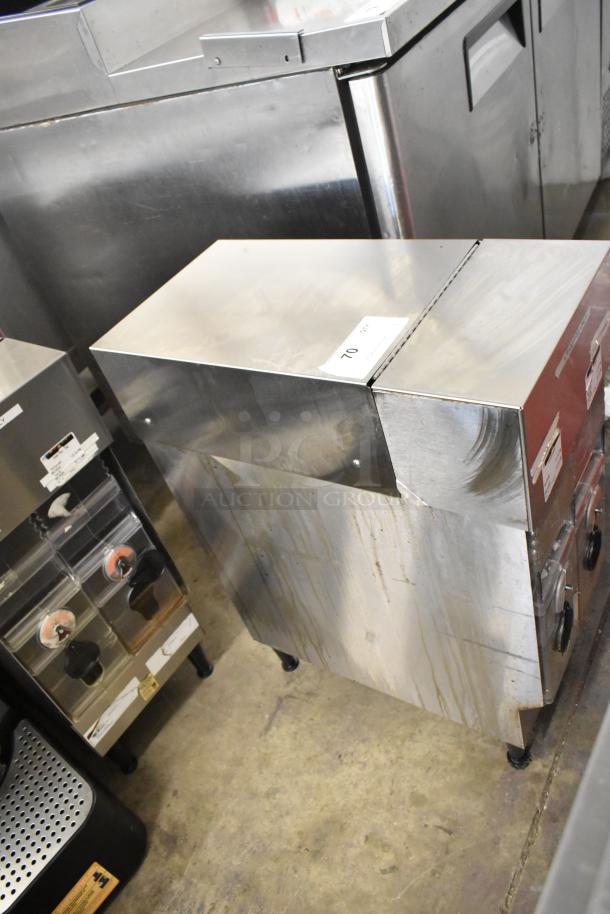 Bunn ICDD-3 stainless steel iced coffee dispenser reservoir, shows signs of use. Tags indicate commercial model.