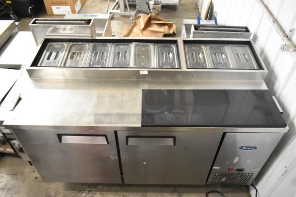 2018 Atosa MPF8202GR stainless steel commercial prep table with casters, top compartments, 115V, 1 phase, good condition.