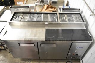 2018 Atosa MPF8202GR stainless steel commercial prep table with casters, top compartments, 115V, 1 phase, good condition.