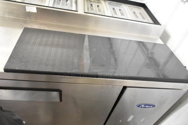 2018 Atosa MPF8202GR stainless steel prep table on casters, 115V, 1 phase, with black top. Good condition, minor wear.
