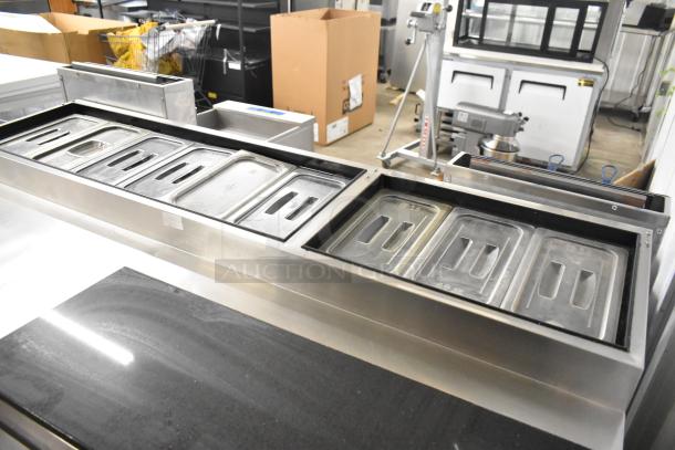 2018 Atosa MPF8202GR stainless steel prep table with commercial casters. Features lidded compartments, 115 volts, 1 phase.