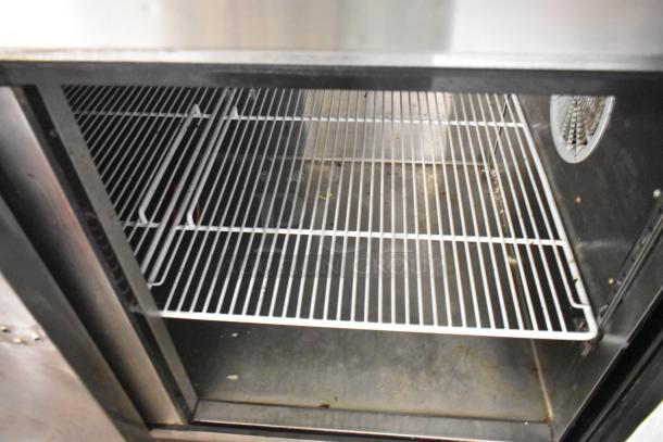 2018 Atosa MPF8202GR stainless steel prep table interior with wire shelving, showing clean storage space. 115V, 1 phase.