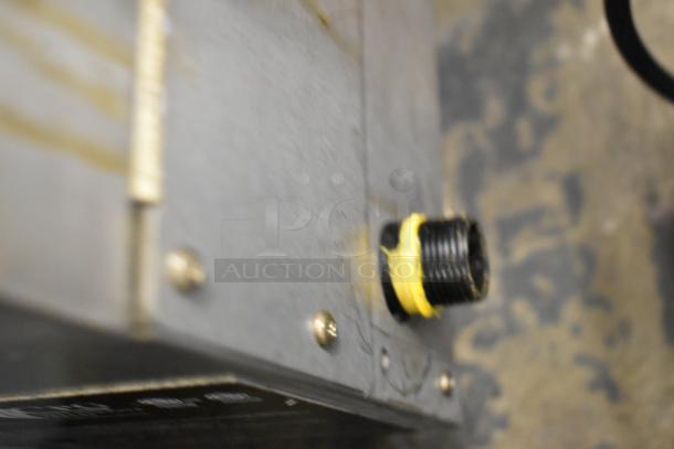 Close-up of the 2022 Cooking Performance Group charbroiler gas connector, model 351CLNG36NL, showing natural gas compatibility.